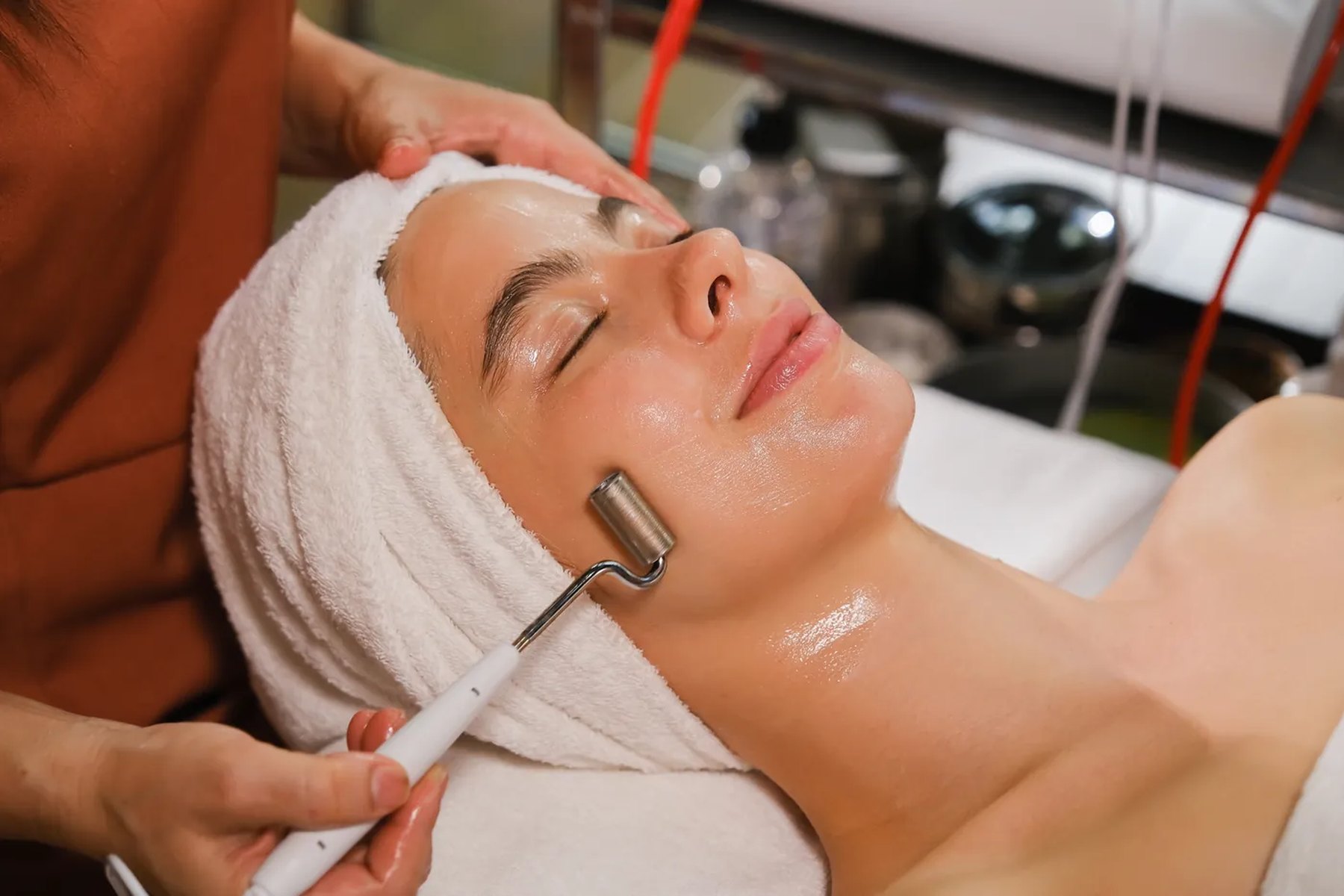 Client receiving a hydrating facial treatment in a calm studio room
