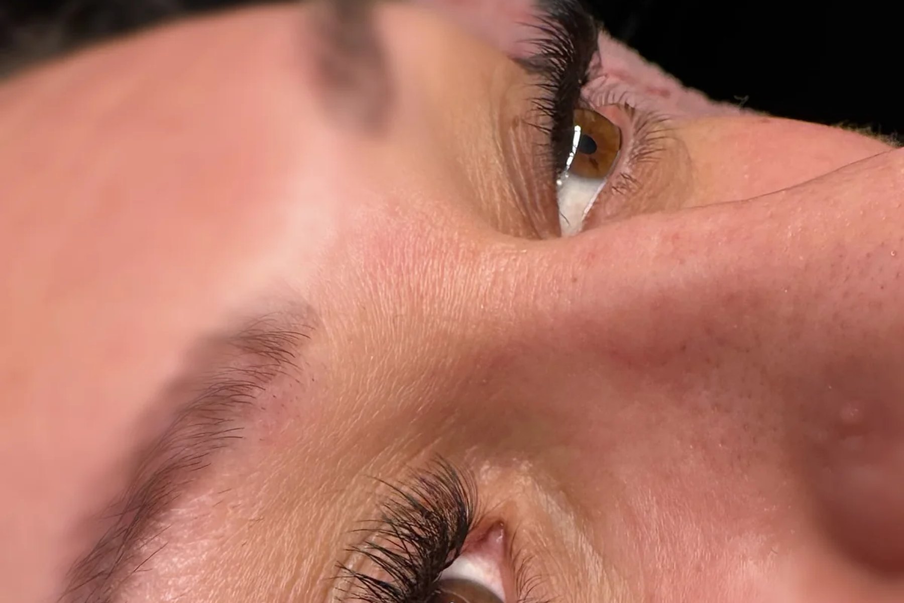 Freshly cleansed lash extensions brushed into place